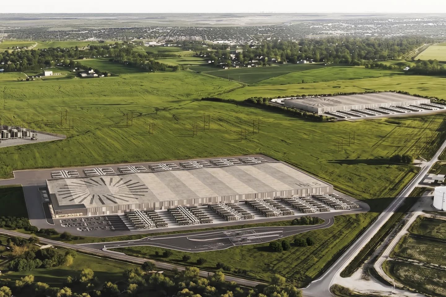 Aerial rendering of Hut 8’s Beacon Point AI data center campus in Nueces County, Texas: two long low-rise data halls with rooftop cooling arrays and a HUT 8 sunburst mark, an on-site electrical substation and transmission lines, set in graded green fields near a highway Aerial rendering of Hut 8’s Beacon Point AI data center campus in Nueces County, Texas: two long low-rise data halls with rooftop cooling arrays and a HUT 8 sunburst mark, an on-site electrical substation and transmission lines, set in graded green fields near a highway